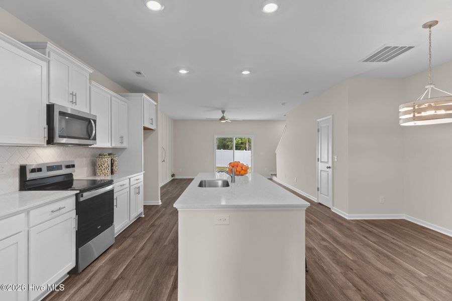 Furnished interior view inside a new home in Coastal Haven Townes, Leland (Image 6).