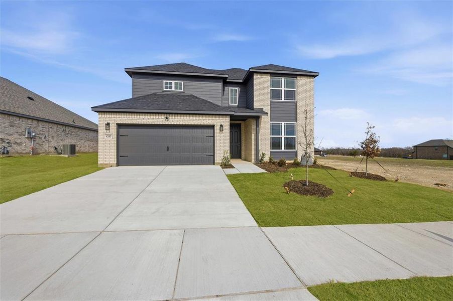 Front exterior of a new home in The Preserve, Sherman, TX, highlighting curb appeal (Image 20).