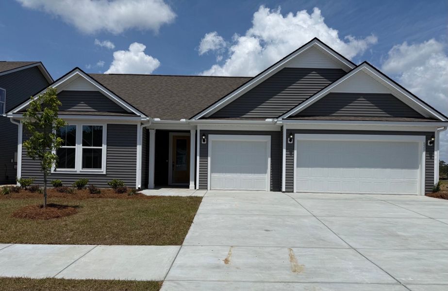 Front exterior of a new home in Del Webb North Myrtle Beach, Myrtle Beach, SC, highlighting curb appeal (Image 20).