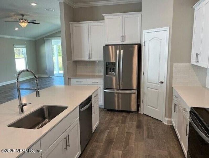 Furnished interior view inside a new home in Sawmill Branch, Palm Coast (Image 17).