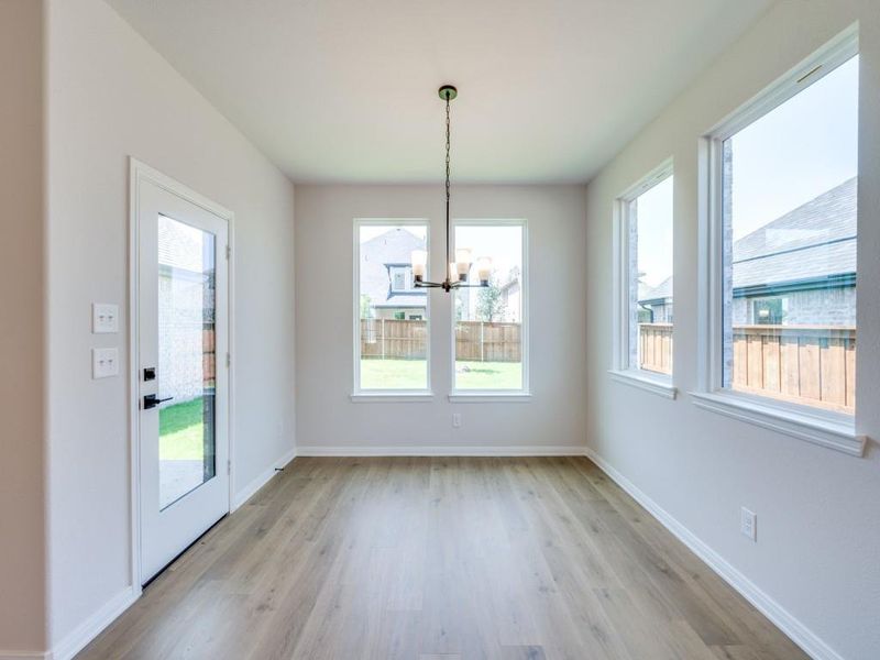 With windows everywhere you look, this lovely dining room brings the outside in!