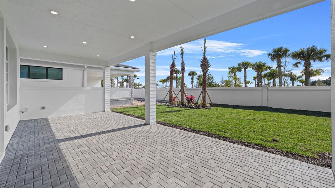 Exterior details and patio area of a home in Esprit at Avenir, Palm Beach Gardens (Image 27).