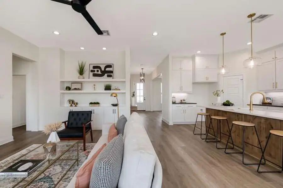 Living area featuring light wood-style floors, recessed lighting, and ceiling fan Living area featuring light wood-style floors, recessed lighting, and ceiling fan