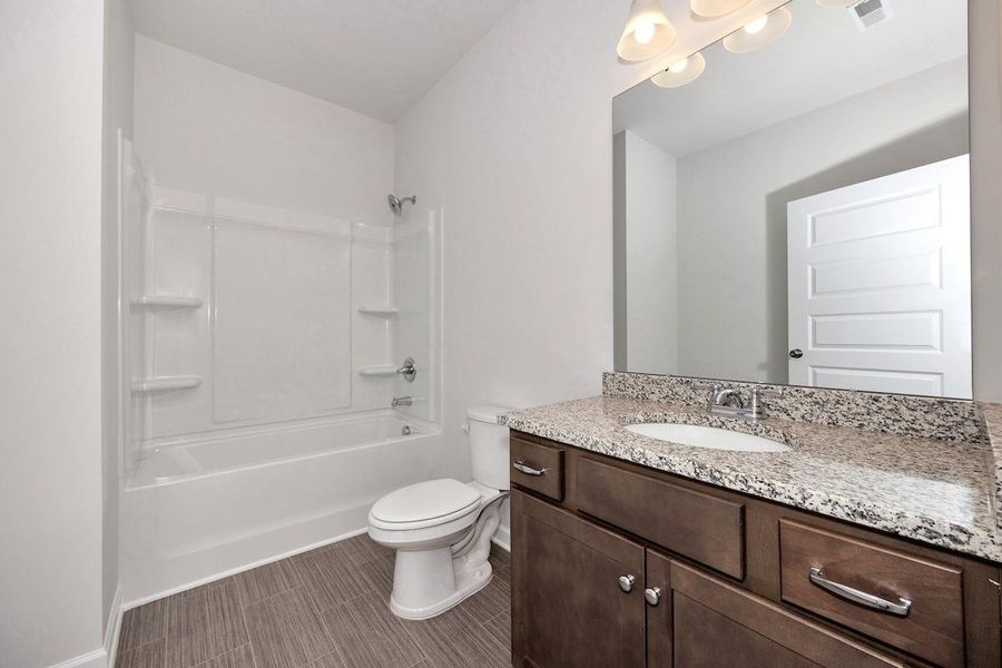 The Avery- Hall Bath 3. Home under construction. Sample floor plan photo used for illustrative purposes only. Upgrades, selections options, and colors will vary.