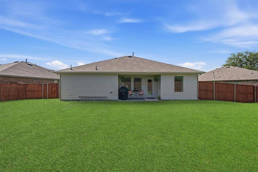 Exterior details and patio area of a home in Three Oaks, Sherman (Image 3).