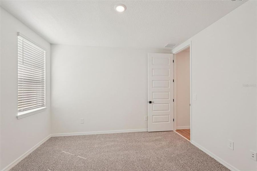 Spacious, unfurnished interior of a new home in Oakfield Trails - Signature Series, Parrish (Image 30).