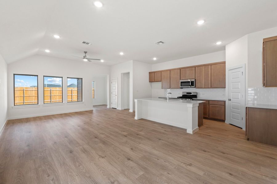 Kitchen in the Quartz home plan by Trophy Signature Homes – REPRESENTATIVE PHOTO
