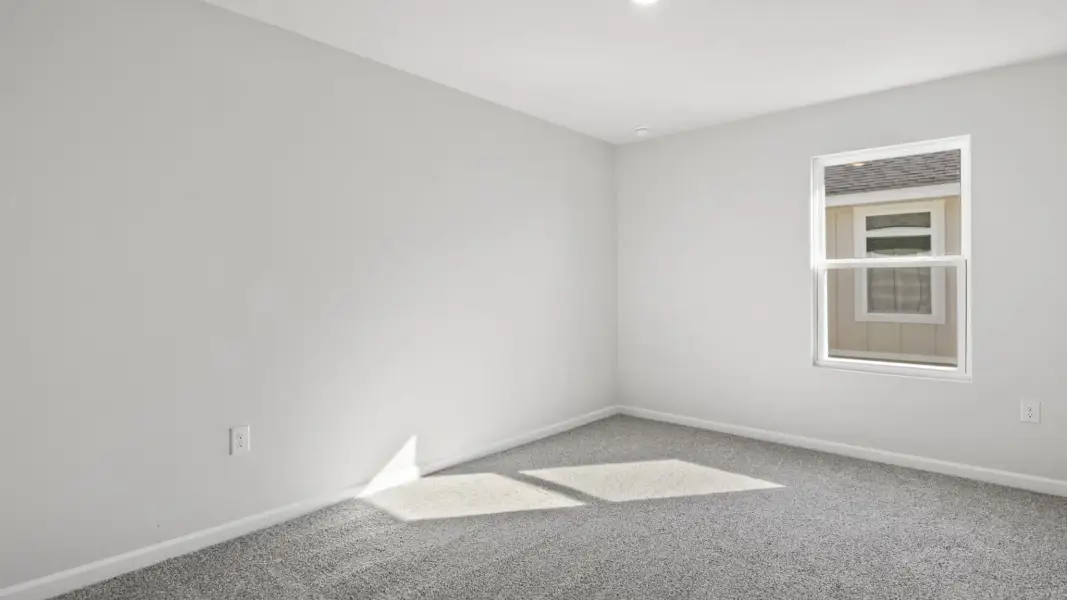 Spacious, unfurnished interior of a new home in Magnolia at the Bluffs Phase 3, Freeport (Image 15).