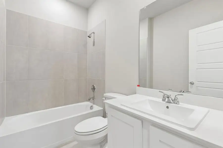 Bathroom in the Winters home plan by Trophy Signature Homes – REPRESENTATIVE PHOTO