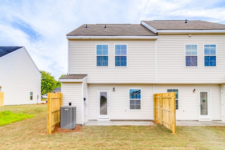Exterior details and patio area of a home in Padgett Commons, Hopkins (Image 4).