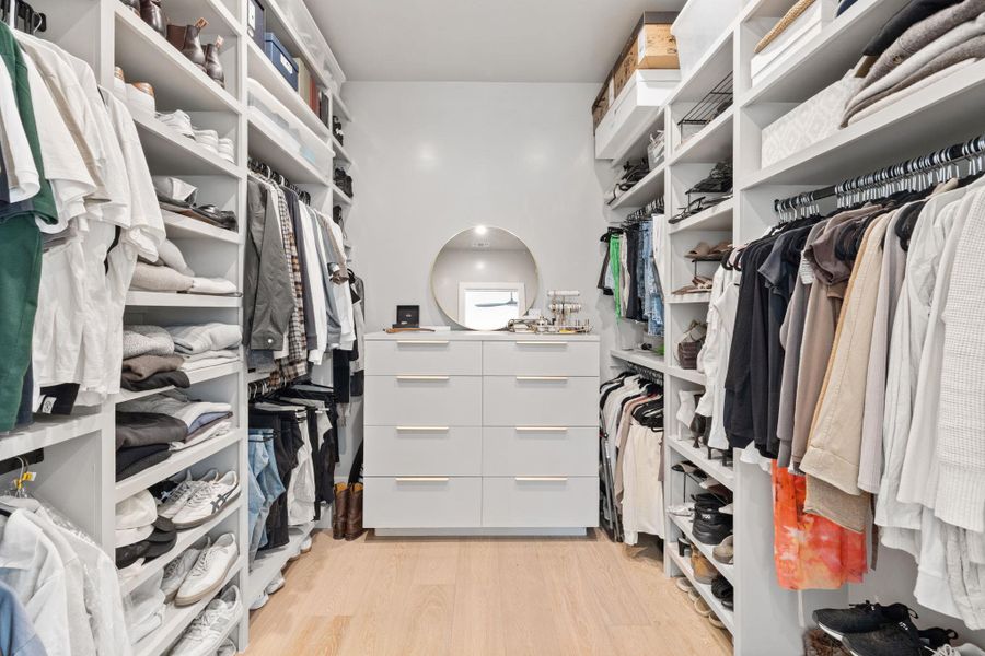 Walk in closet featuring light wood-type flooring