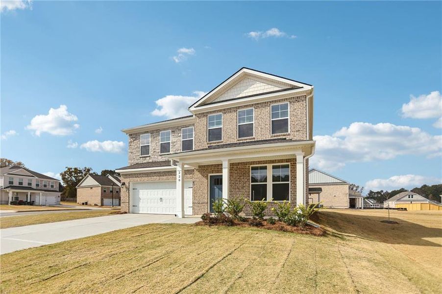 Front exterior of a new home in Burchwood, Stockbridge, GA, highlighting curb appeal (Image 2). Front exterior of a new home in Burchwood, Stockbridge, GA, highlighting curb appeal (Image 2).