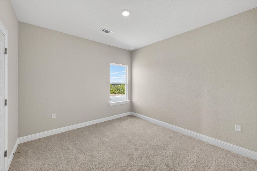 Unfurnished room with light colored carpet and recessed lighting Unfurnished room with light colored carpet and recessed lighting