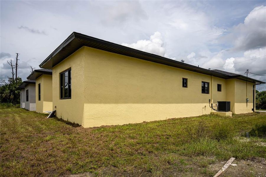 Front exterior of a new home in , Rotonda West, FL, highlighting curb appeal (Image 2).