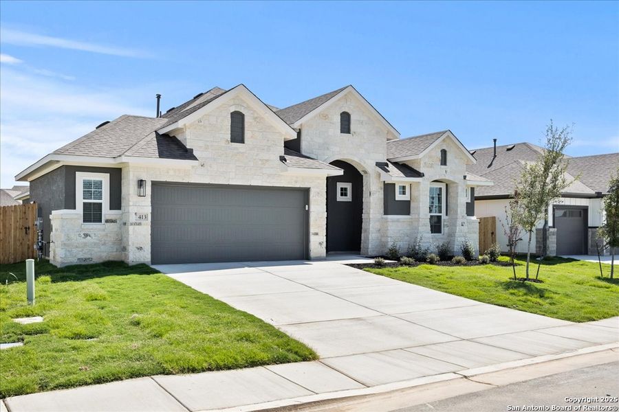 Front exterior of a new home in Village at Three Oaks, Seguin, TX, highlighting curb appeal (Image 2). Front exterior of a new home in Village at Three Oaks, Seguin, TX, highlighting curb appeal (Image 2).