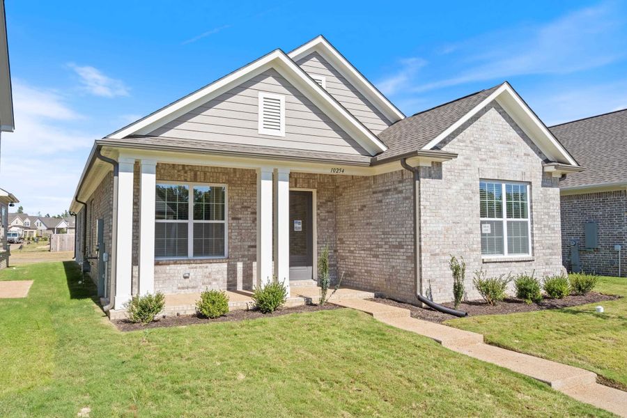 Front exterior of a new home in Lockwood, Collierville, TN, highlighting curb appeal (Image 2). Front exterior of a new home in Lockwood, Collierville, TN, highlighting curb appeal (Image 2).