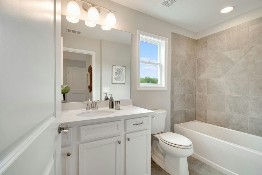 Representative furnished interior of a home built from the The Everleigh by Windsong Properties in Madeira, Acworth (Image 13).