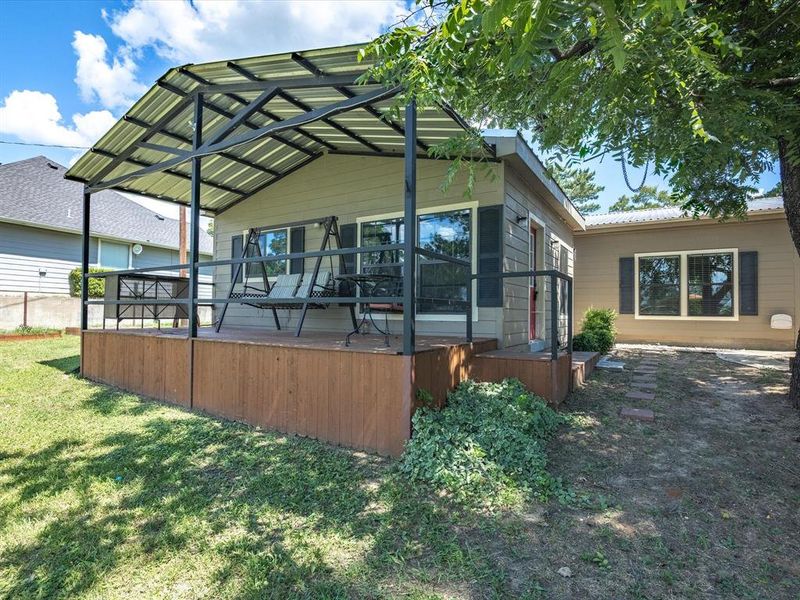 Rear view of house with a lawn Rear view of house with a lawn