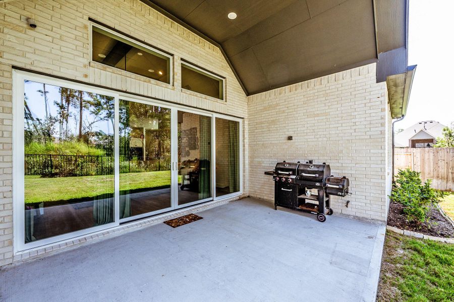 Exterior details and patio area of a home in , Conroe (Image 3).