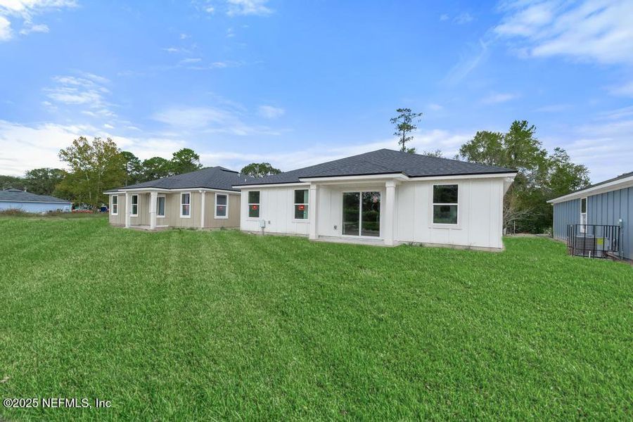 Front exterior of a new home in , Jacksonville, FL, highlighting curb appeal (Image 19). Front exterior of a new home in , Jacksonville, FL, highlighting curb appeal (Image 19).