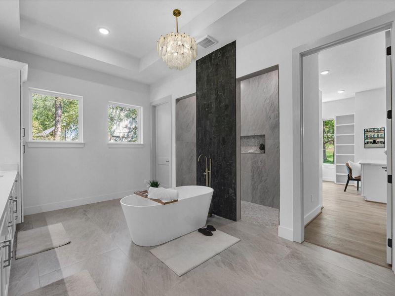 Another angle of the primary bathroom showing the oversized step in shower