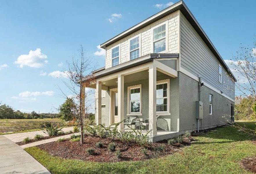 Exterior details and patio area of a home in Hawks Run, Kissimmee (Image 25).