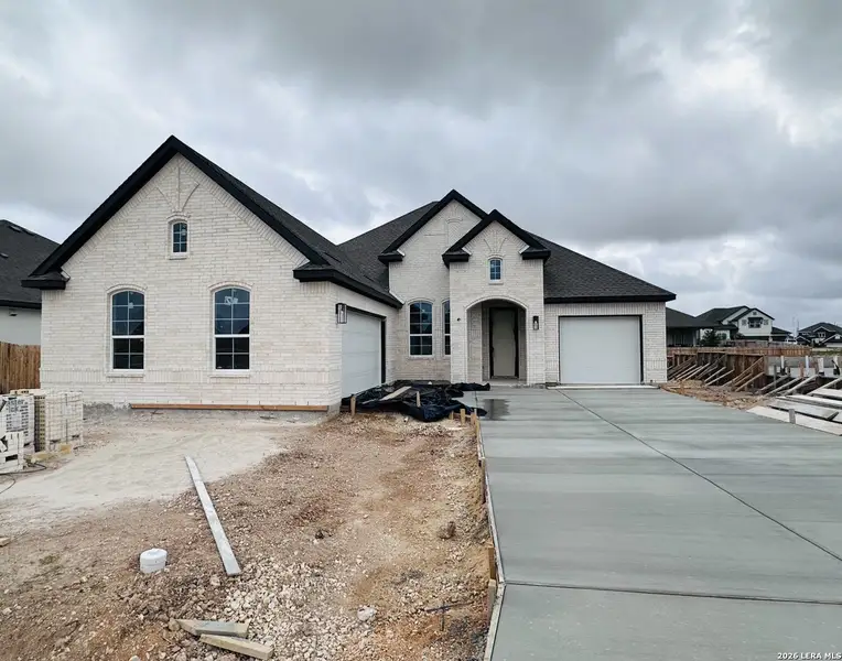 In-progress construction of a new home in Village at Three Oaks, Seguin, TX (Image 13).