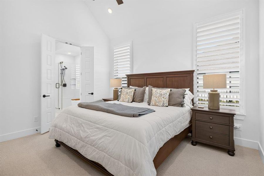 Primary suite...notice the high caliber carpet, the plantation shutters, the TALL ceilings with custom fan. Primary suite...notice the high caliber carpet, the plantation shutters, the TALL ceilings with custom fan.