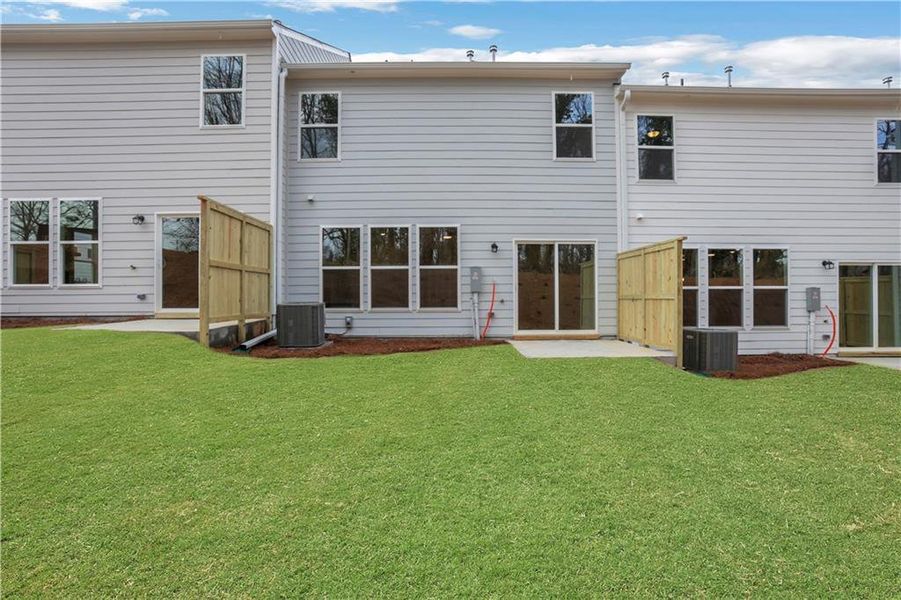 Exterior details and patio area of a home in Villas at Dawsonville Townhomes, Dawsonville (Image 22).