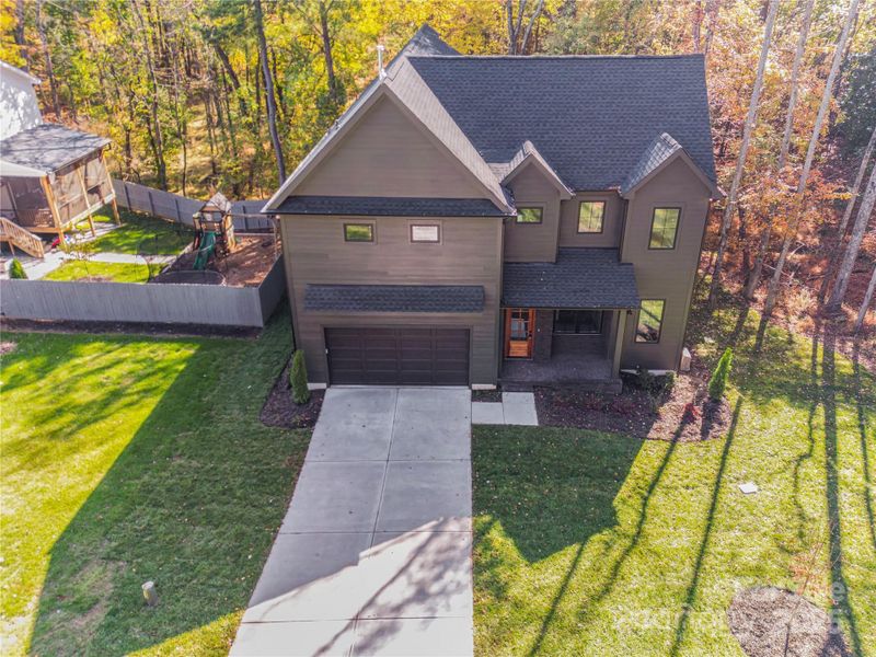 Front exterior of a new home in , Matthews, NC, highlighting curb appeal (Image 1).