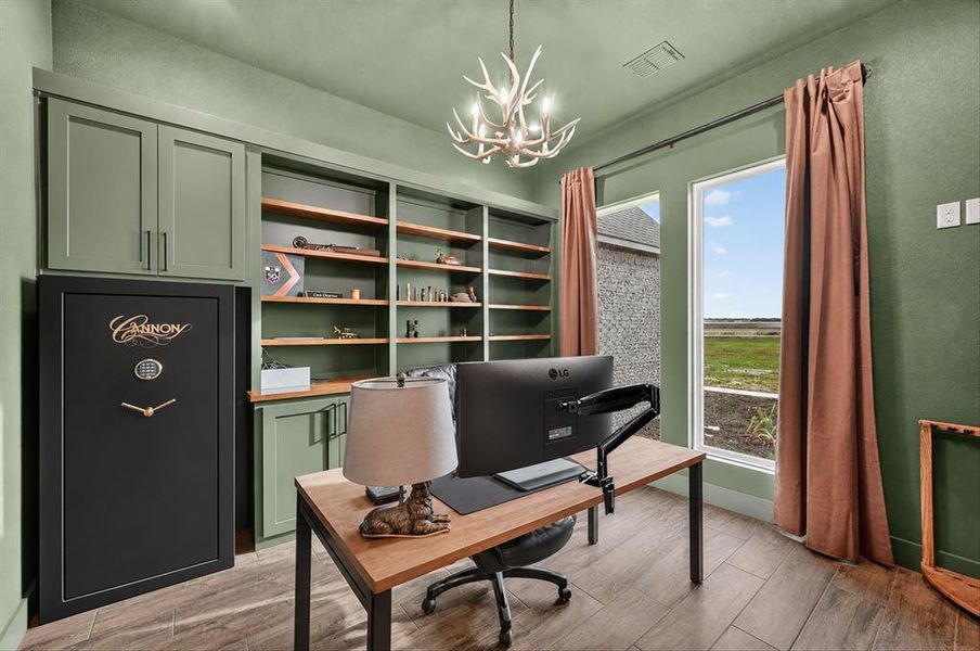 Custom built-in shelving and cabinetry complement the rich wood-finish flooring