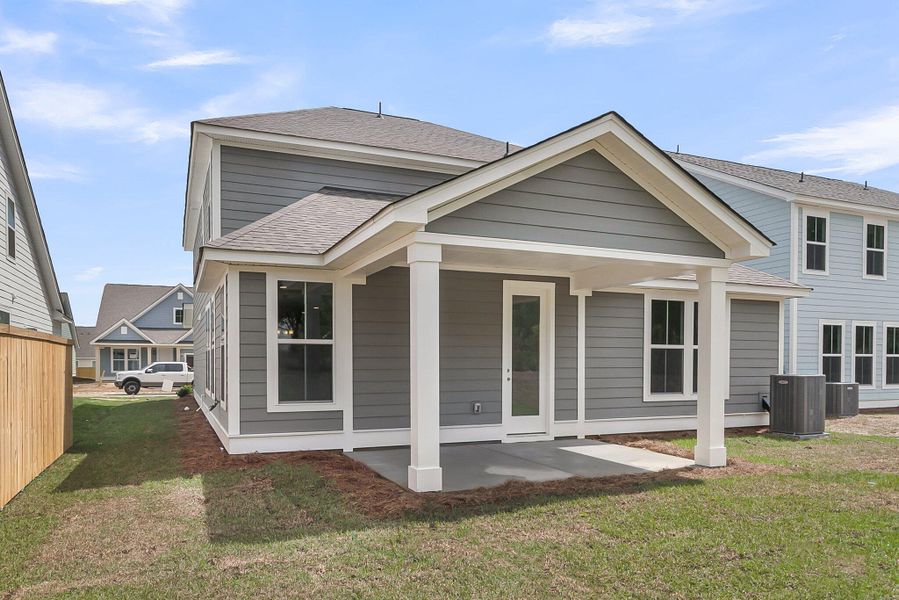 Front exterior of a new home in Sweetgrass Station, Summerville, SC, highlighting curb appeal (Image 21).
