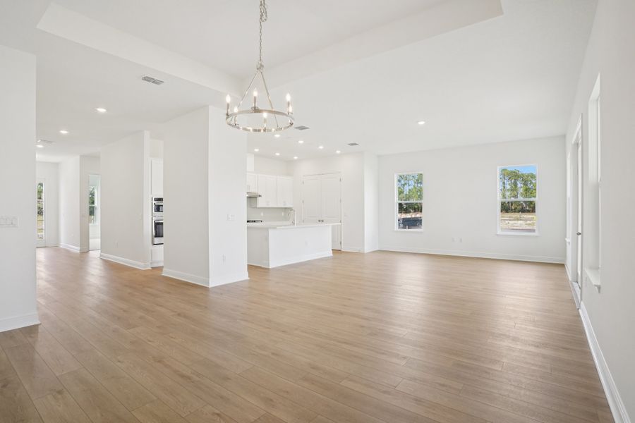 Representative unfurnished interior of a home built from the Siesta II by Ashton Woods in Ardisia Park, New Smyrna Beach (Image 7).