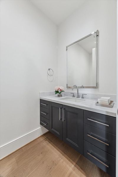 Sophisticated powder room. Photos are of a similar unit with the same floor plan