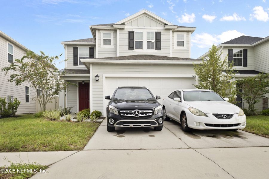 Front exterior of a new home in , St. Johns, FL, highlighting curb appeal (Image 20).