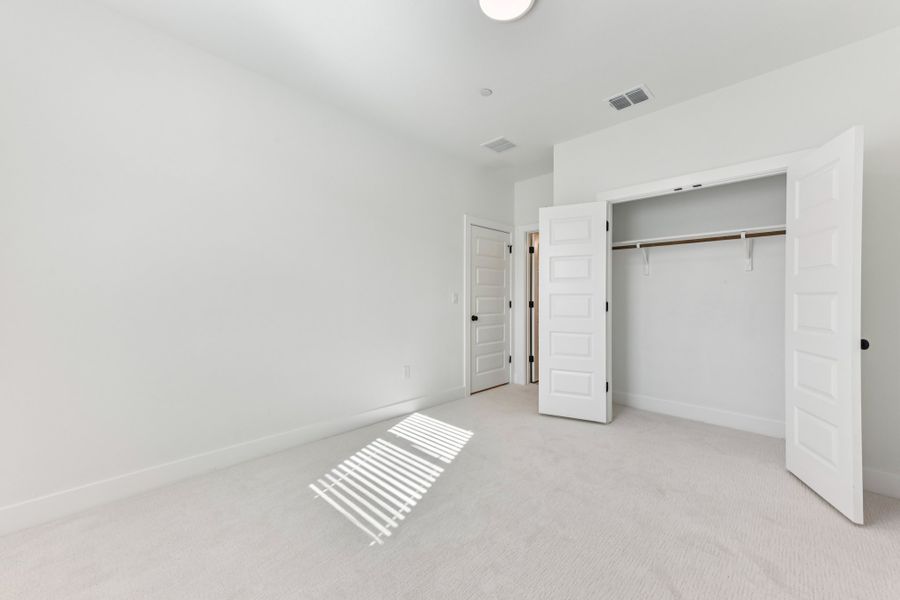 Spacious, unfurnished interior of a new home in Koenig Townhomes, Austin (Image 26).