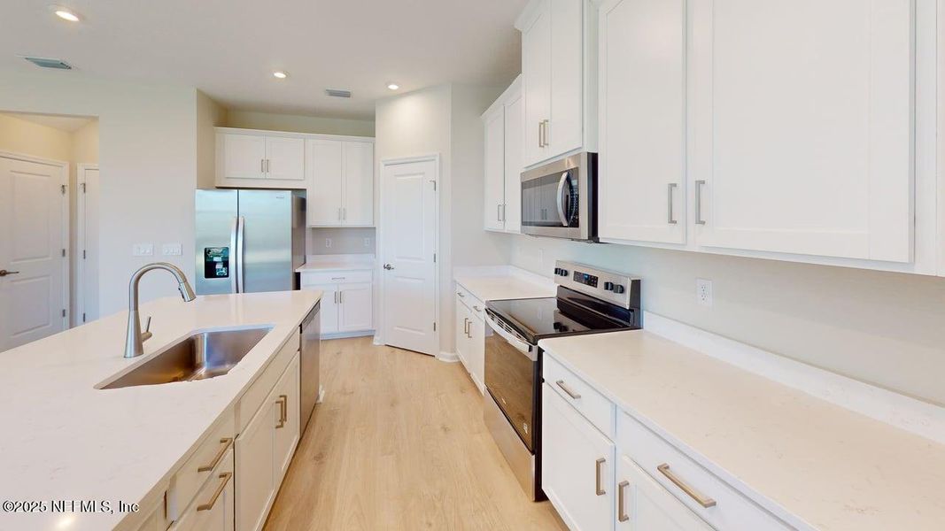 Furnished interior view inside a new home in Lakes at Bella Lago, Green Cove Springs (Image 4). Furnished interior view inside a new home in Lakes at Bella Lago, Green Cove Springs (Image 4).