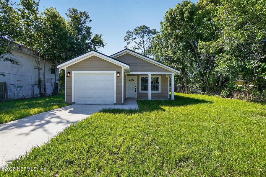Front exterior of a new home in , Jacksonville, FL, highlighting curb appeal (Image 20).