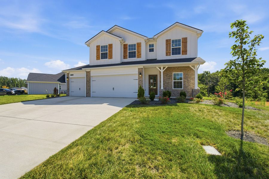 Front exterior of a new home in Brush Creek, Fairview, TN, highlighting curb appeal (Image 26). Front exterior of a new home in Brush Creek, Fairview, TN, highlighting curb appeal (Image 26).