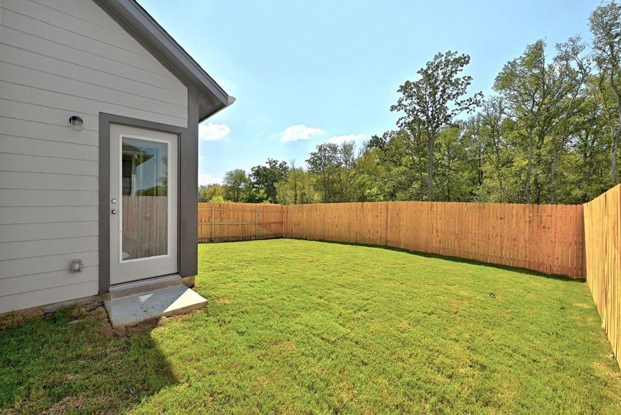 Exterior details and patio area of a home in Trinity Ranch, Elgin (Image 20).
