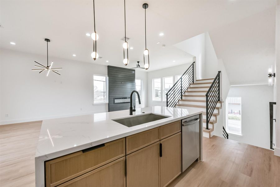 Back view of the kitchen open to the living and dining room.