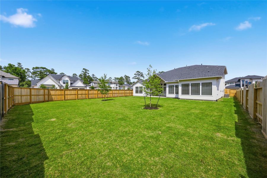 Oversized backyard with endless potential for a future pool, outdoor kitchen, or custom entertaining space - offering privacy, green space, and room to create your dream outdoor retreat.