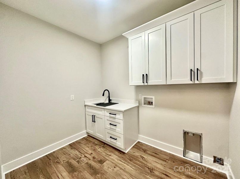 Spacious Laundry Room w/plenty of storage
