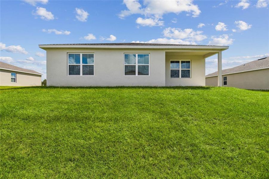 Exterior details and patio area of a home in Aspire at The Pines, Dunnellon (Image 24).