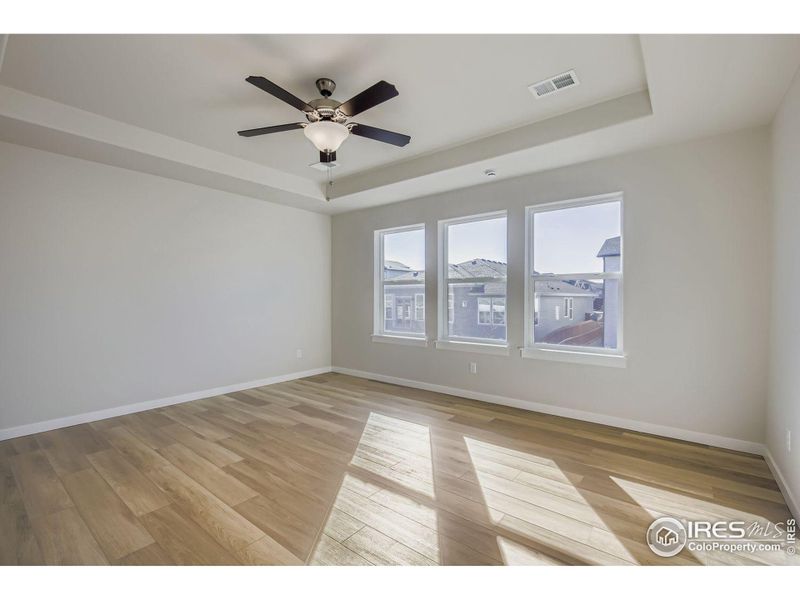 Spacious, unfurnished interior of a new home in RainDance National 60/70, Windsor (Image 17).