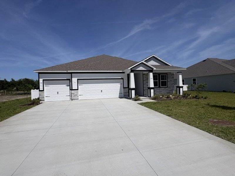 Front exterior of a new home in Winding River, St. Marys, GA, highlighting curb appeal (Image 1). Front exterior of a new home in Winding River, St. Marys, GA, highlighting curb appeal (Image 1).