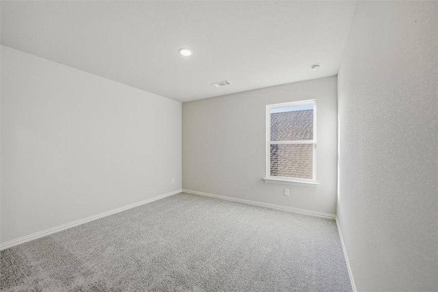 Spare room featuring carpet and baseboards Spare room featuring carpet and baseboards
