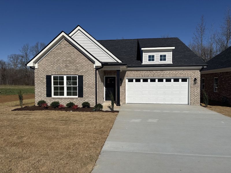 Front exterior of a new home in Legacy Preserve, Tullahoma, TN, highlighting curb appeal (Image 1). Front exterior of a new home in Legacy Preserve, Tullahoma, TN, highlighting curb appeal (Image 1).