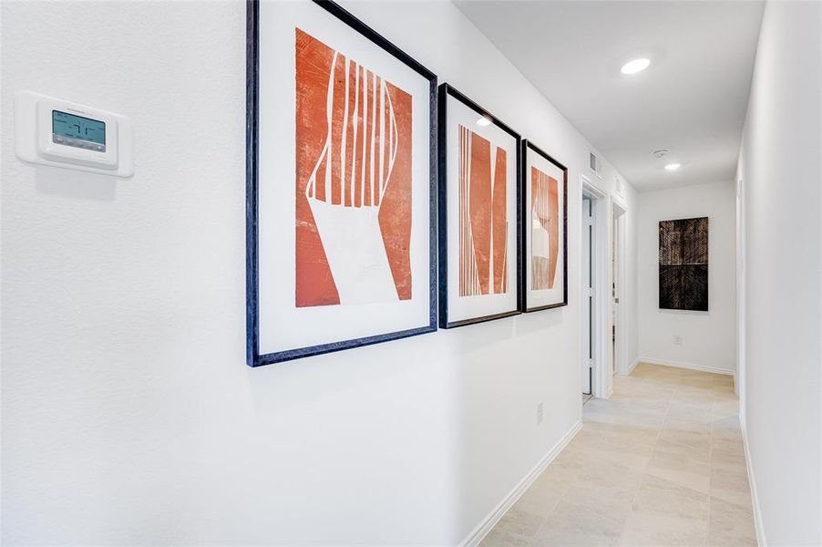 Corridor featuring light tile patterned flooring