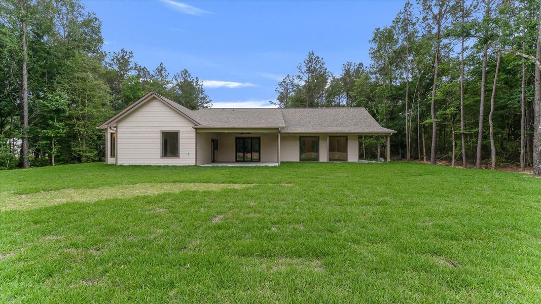 Exterior details and patio area of a home in , Conroe (Image 23).
